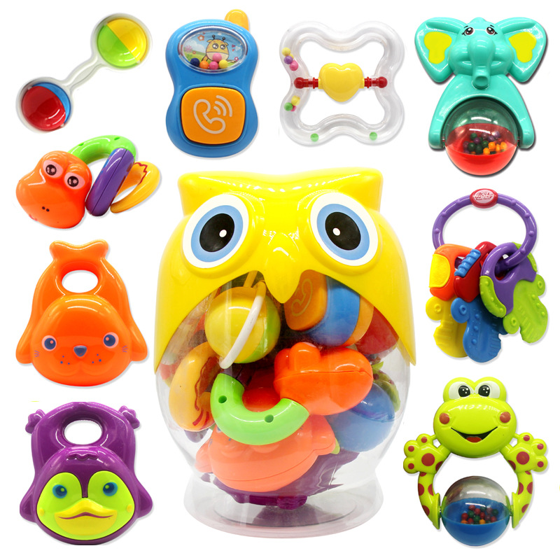 Set of 9 sensory rattles in its owl box.